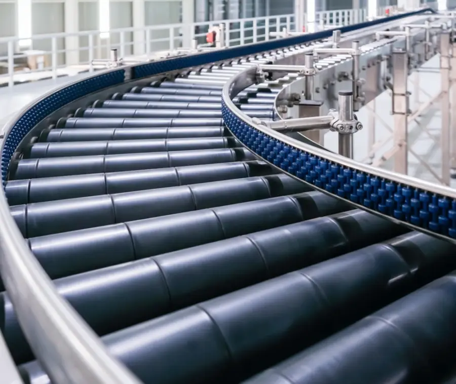 Conveyor belt in a factory automating tasks to improve efficiency for trade businesses.