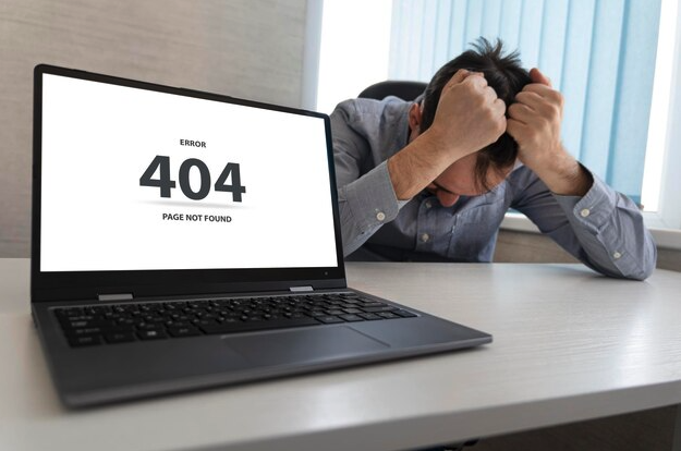 A person looking at a laptop screen displaying a 'Page Not Found' error message, showing the frustration of potential customers.